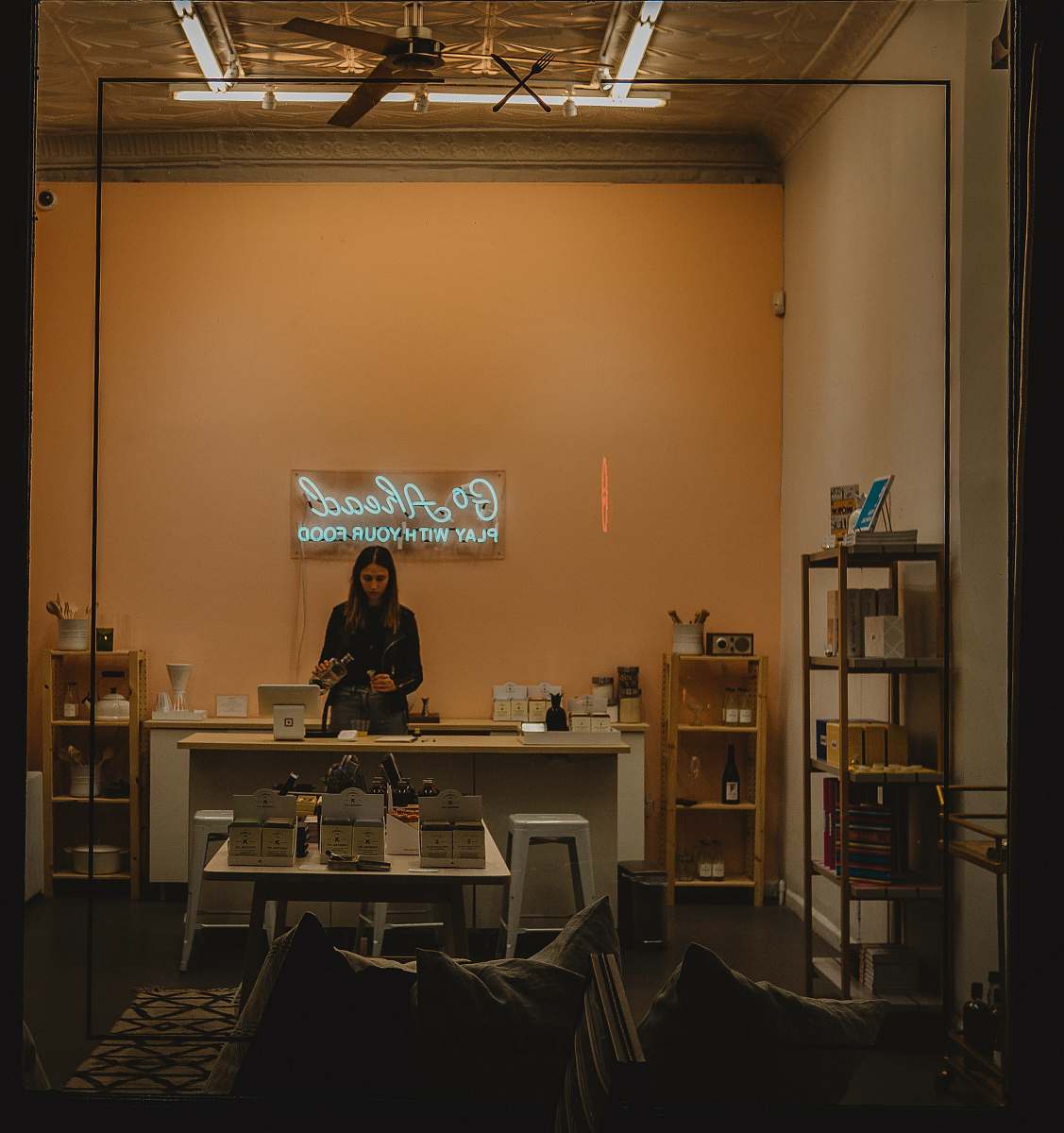 manhattan woman standing behind desk brown